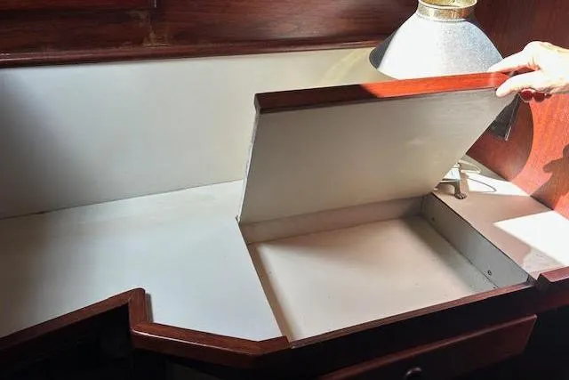 Slide: The Image of Hidden compartment in a custom 1985 desk with a lamp and wooden trim. - 26
