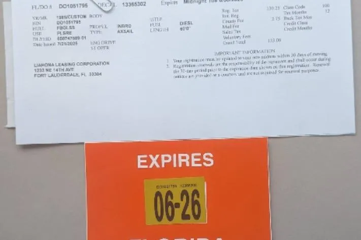 Slide: The Image of Vehicle registration document and Florida expiration sticker, Custom model 60, year 1985. - 29