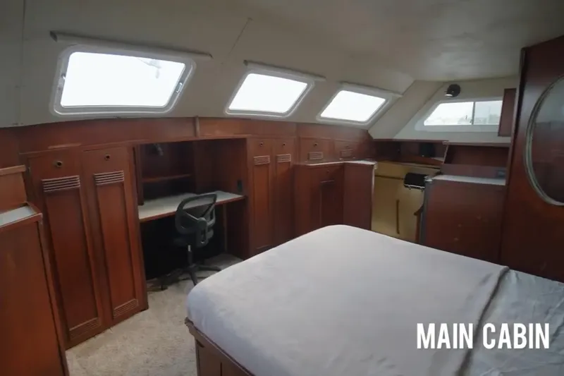 Slide: The Image of Main cabin of 1985 Custom 60 yacht with wood paneling and desk. - 35