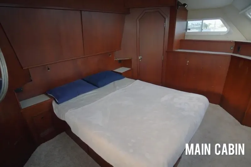 Slide: The Image of Main cabin of 1985 Custom 60 yacht with wooden interior and double bed. - 36
