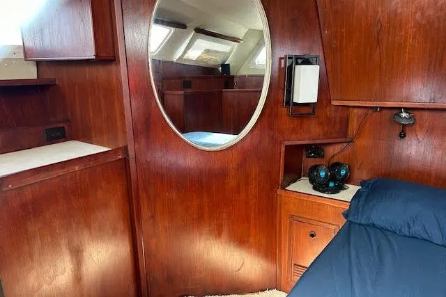 Slide: The Image of Wood-paneled cabin interior with round mirror, Custom 60 model, 1985. - 39