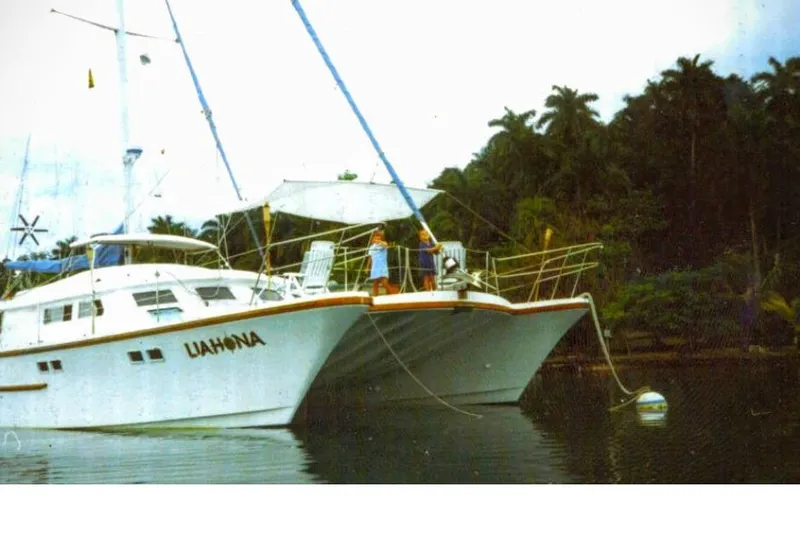 Slide: The Image of Custom 1985 model 60 yacht "Liahona" anchored near lush tropical shoreline. - 4