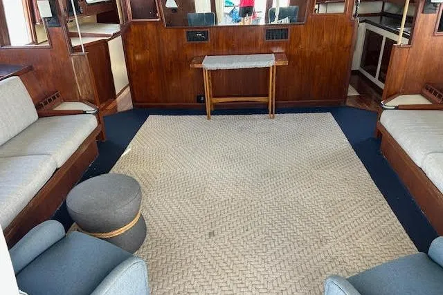Slide: The Image of Interior of a 1985 Custom 60 yacht with cozy seating and wooden accents. - 43