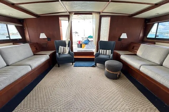 Slide: The Image of Luxurious interior of a 1985 Custom 60 yacht with elegant seating and nautical decor. - 47