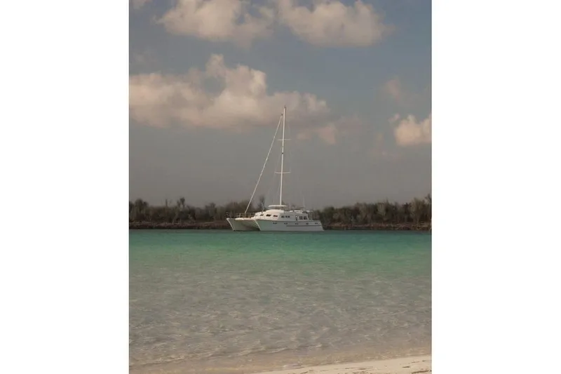 Slide: The Image of Sailboat on turquoise water under cloudy sky, Custom 60 model, 1985. - 5
