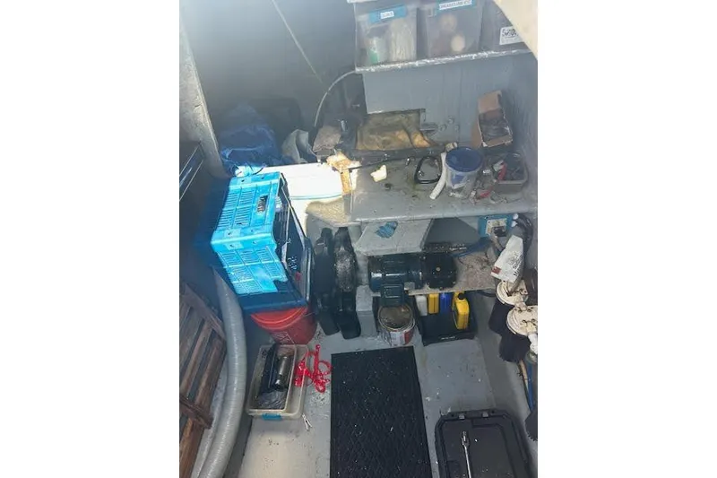 Slide: The Image of Workshop with tools and supplies on shelves, featuring a Custom 60 model from 1985. - 66