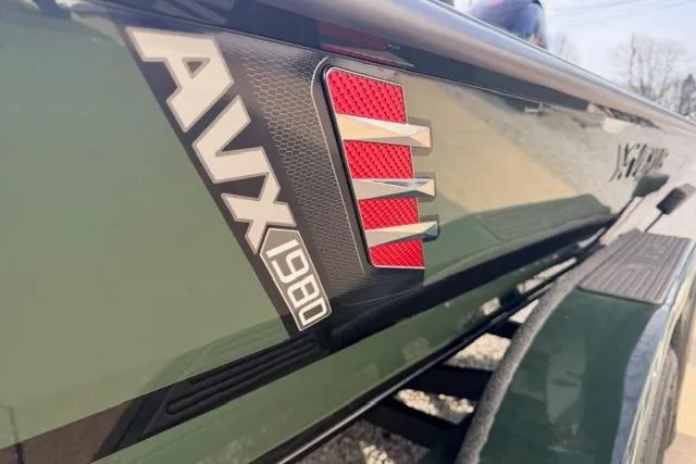 Slide: The Image of 2026 Vexus AVX1980 boat close-up, showcasing sleek design and branding details. - 12