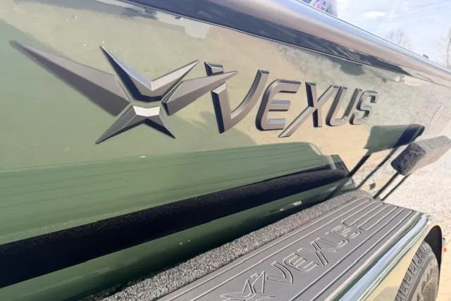 Slide: The Image of 2026 Vexus AVX1980 boat logo on green exterior with textured step detail. - 13