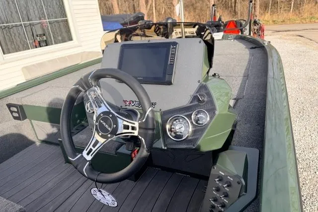 Slide: The Image of 2026 Vexus AVX1980 boat dashboard with steering wheel and digital display. - 5