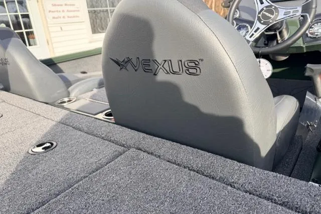 Slide: The Image of 2026 Vexus AVX1980 boat interior with logo on gray seats. - 6