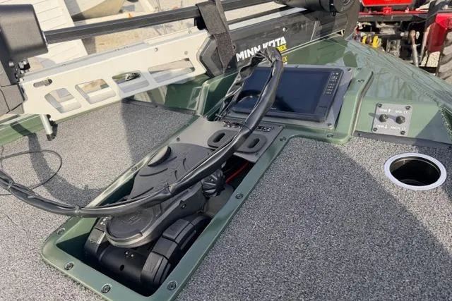 Slide: The Image of 2026 Vexus AVX1980 boat dashboard with Minn Kota trolling motor and navigation display. - 8