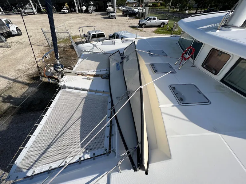 Slide: The Image of Lagoon 420 catamaran 2008 model on dry dock, showing deck and netting. - 14