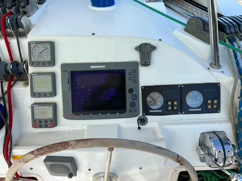 Slide: The Image of Lagoon 420 2008 yacht control panel with navigation instruments and Yanmar engine gauges. - 18