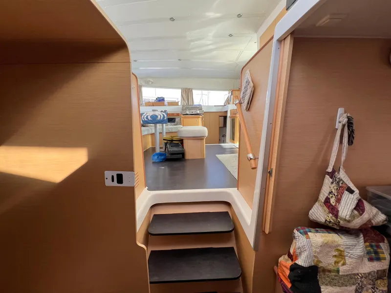 Slide: The Image of Interior of 2008 Lagoon 420 catamaran, showing steps leading to the main cabin area. - 37