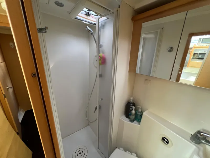 Slide: The Image of 2008 Lagoon 420 yacht bathroom with shower and sink. - 42