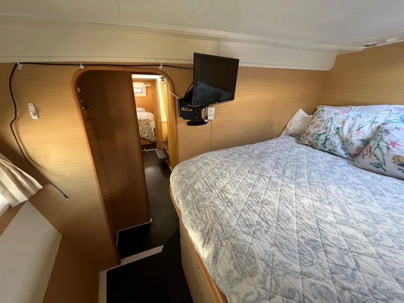 Slide: The Image of Interior cabin of 2008 Lagoon 420 catamaran with bed and TV. - 47