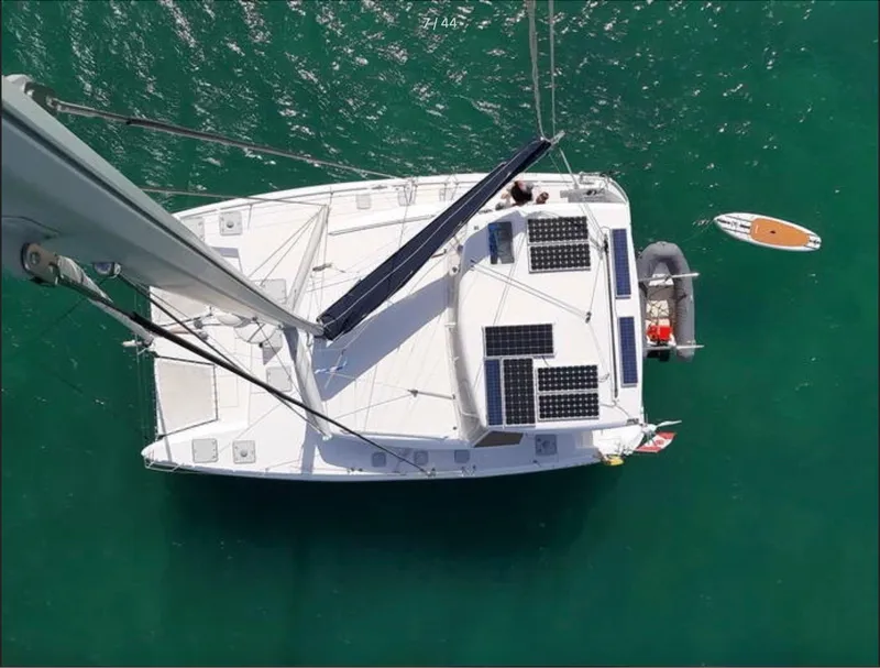 Slide: The Image of Aerial view of 2008 Lagoon 420 catamaran with solar panels on deck. - 68