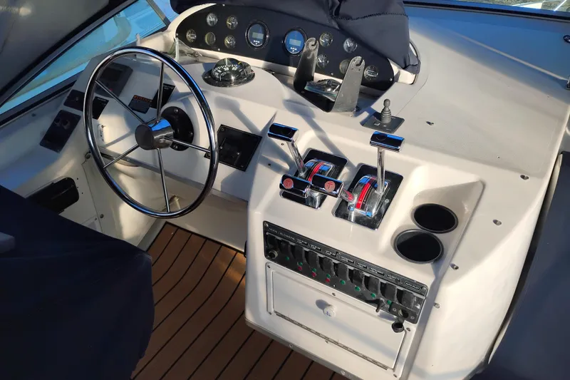 Slide: The Image of Cockpit of 2000 Bayliner 3988 Command Bridge Motoryacht with steering wheel and controls. - 11