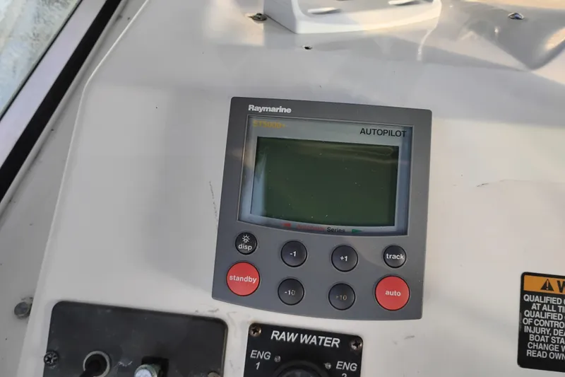 Slide: The Image of Raymarine autopilot control on 2000 Bayliner 3988 Command Bridge Motoryacht dashboard. - 13