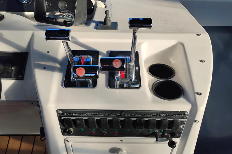 Slide: The Image of Control panel of a 2000 Bayliner 3988 Command Bridge Motoryacht with throttle levers and switches. - 14