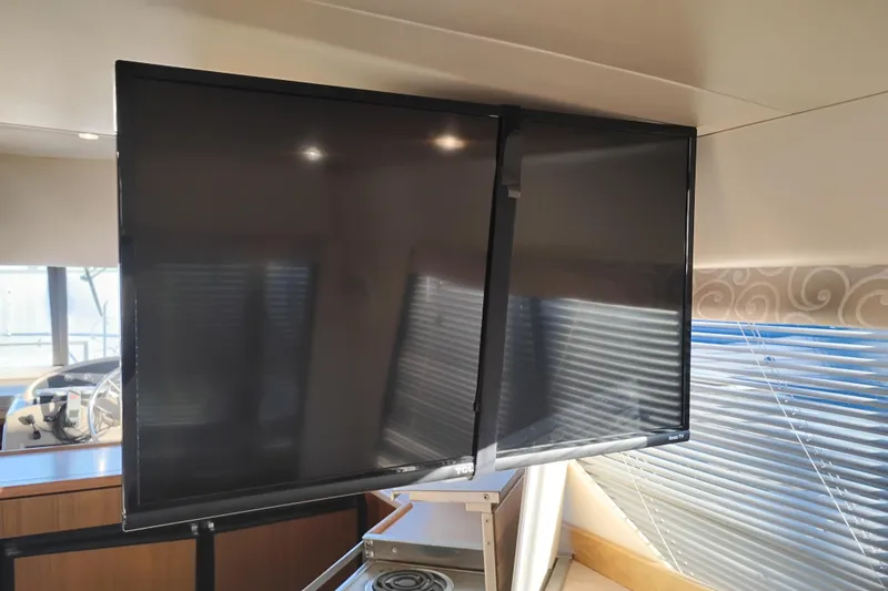 Slide: The Image of Dual monitors inside 2000 Bayliner 3988 Command Bridge Motoryacht cabin. - 24