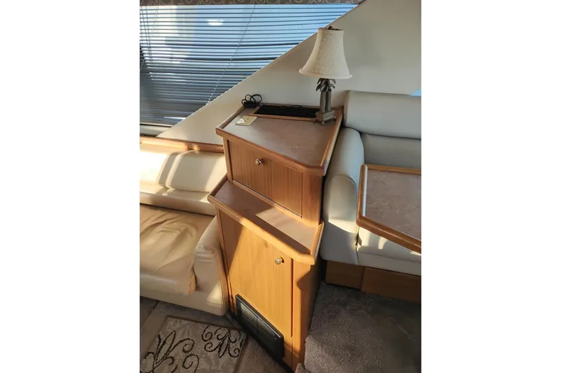 Slide: The Image of Interior of 2000 Bayliner 3988 Command Bridge Motoryacht with wooden cabinetry and lamp. - 25