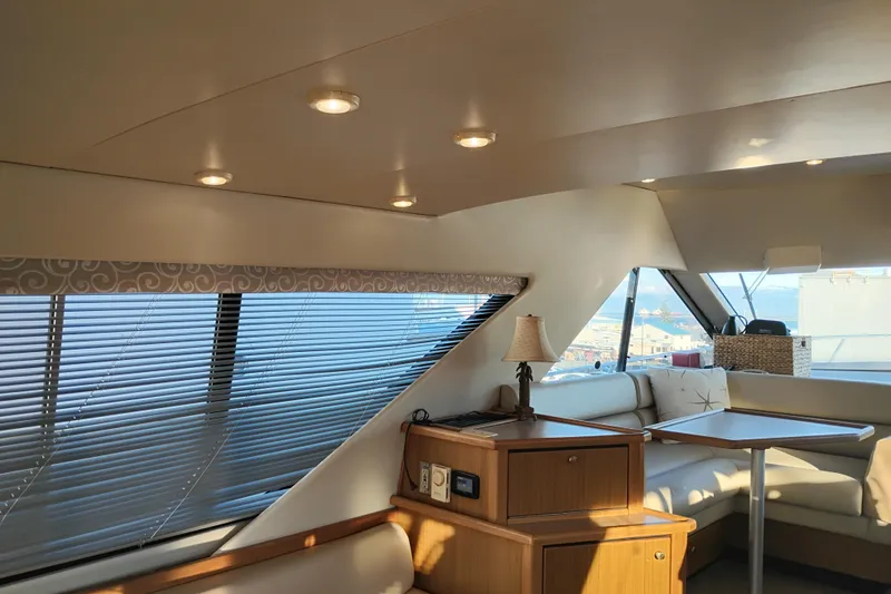 Slide: The Image of Interior of 2000 Bayliner 3988 Command Bridge Motoryacht with elegant seating and natural light. - 26