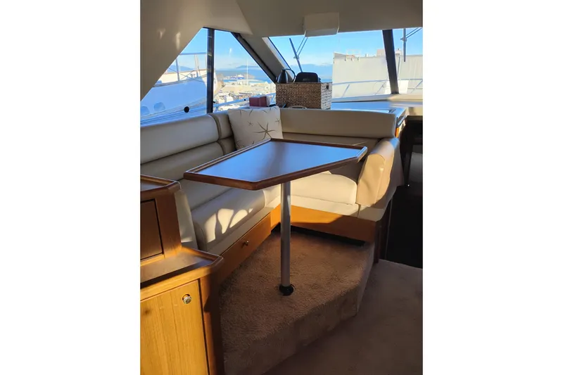 Slide: The Image of Interior of 2000 Bayliner 3988 Command Bridge Motoryacht with seating and table. - 27