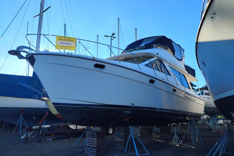Slide: The Image of 2000 Bayliner 3988 Command Bridge Motoryacht for sale, elevated on stands. - 3