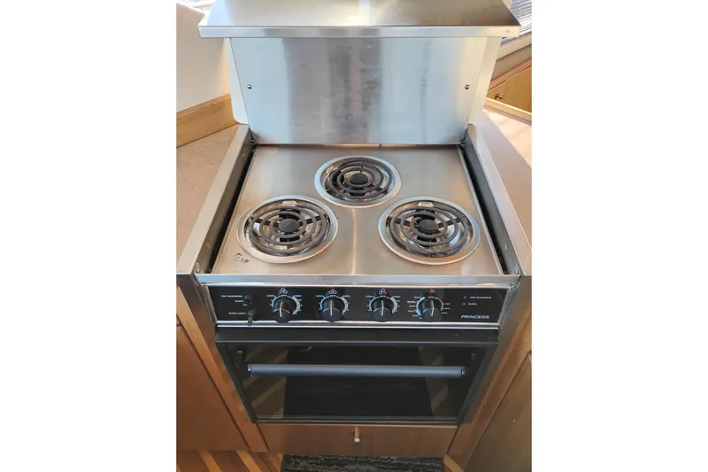 Slide: The Image of Stainless steel stove with three burners on a 2000 Bayliner 3988 Command Bridge Motoryacht. - 32