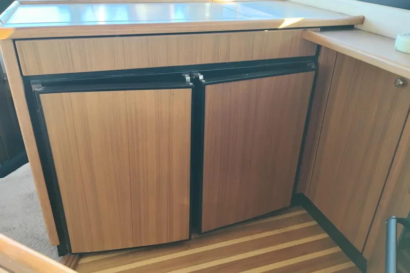 Slide: The Image of Wood-paneled kitchen area in 2000 Bayliner 3988 Command Bridge Motoryacht. - 33