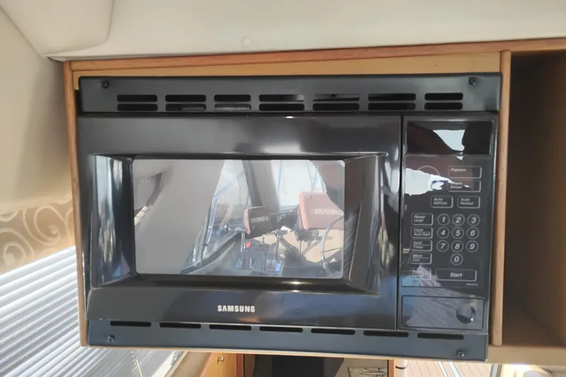 Slide: The Image of Samsung microwave in 2000 Bayliner 3988 Command Bridge Motoryacht kitchen area. - 34