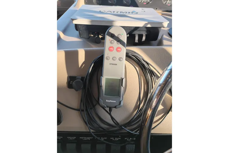 Slide: The Image of Control panel of 2000 Bayliner 3988 Command Bridge Motoryacht with Raytheon ST600R remote. - 38