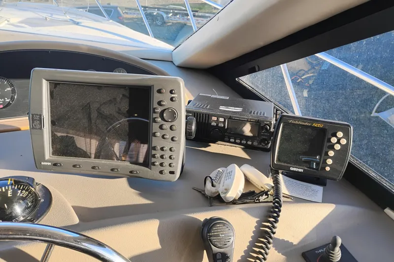 Slide: The Image of Dashboard of 2000 Bayliner 3988 Command Bridge Motoryacht with navigation equipment. - 41