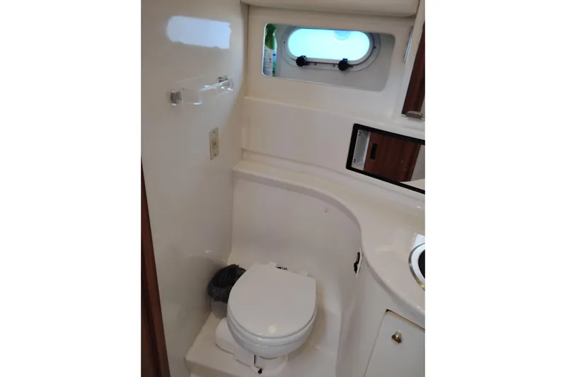 Slide: The Image of Bathroom interior of 2000 Bayliner 3988 Command Bridge Motoryacht with porthole and toilet. - 47