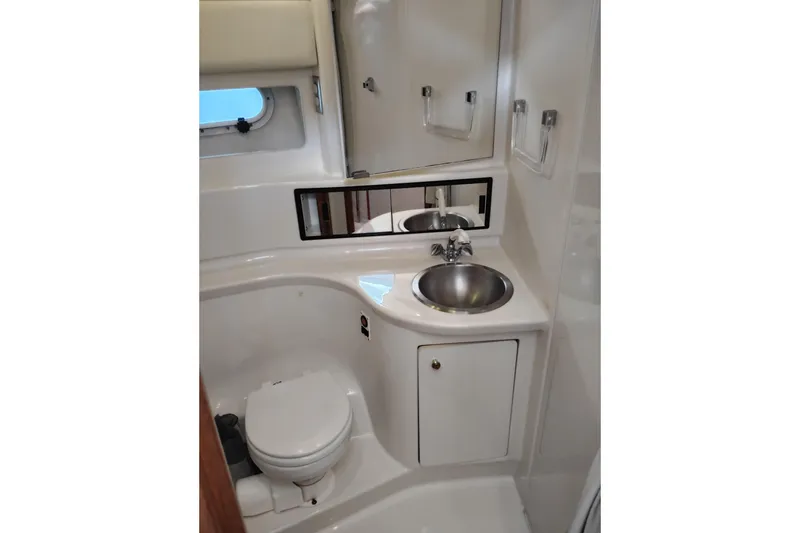 Slide: The Image of Bathroom interior of 2000 Bayliner 3988 Command Bridge Motoryacht with sink and toilet. - 48