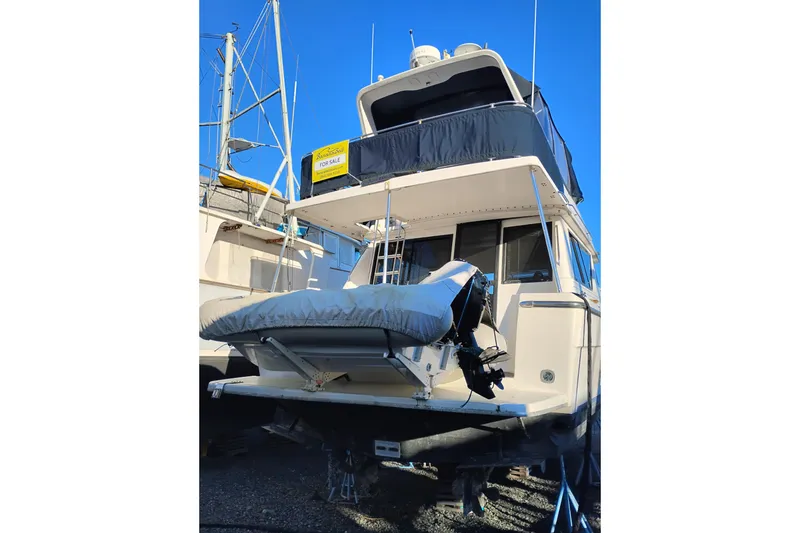 Slide: The Image of 2000 Bayliner 3988 Command Bridge Motoryacht for sale, docked with covered motor. - 5