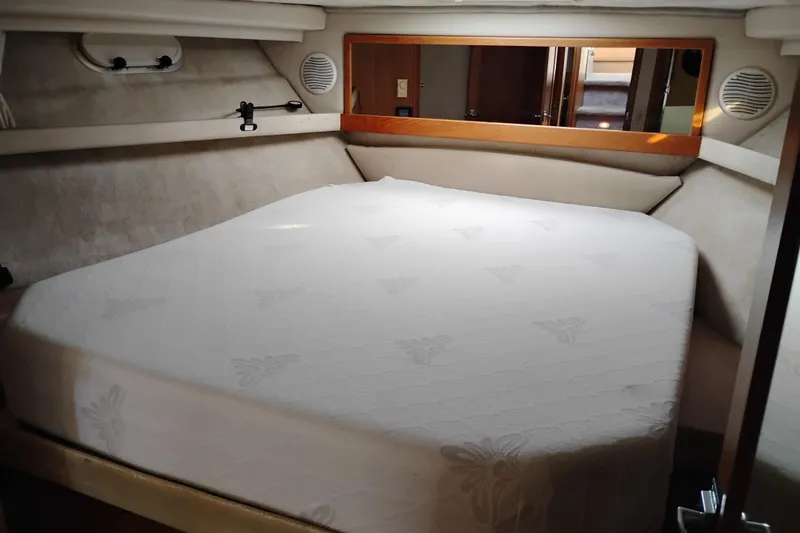 Slide: The Image of Cozy bedroom in 2000 Bayliner 3988 Command Bridge Motoryacht with plush bedding. - 50