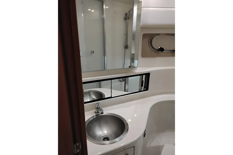 Slide: The Image of Bathroom interior of 2000 Bayliner 3988 Command Bridge Motoryacht with sink and mirror. - 55