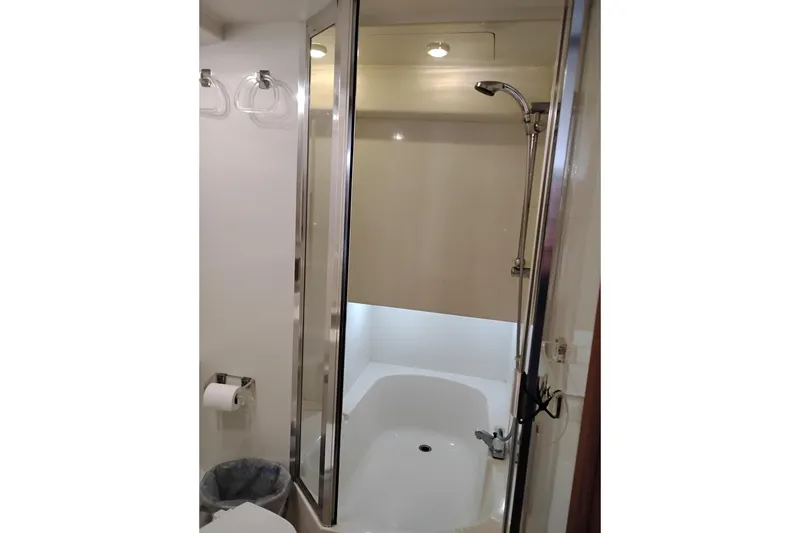 Slide: The Image of 2000 Bayliner 3988 Command Bridge Motoryacht bathroom with shower and modern fixtures. - 57
