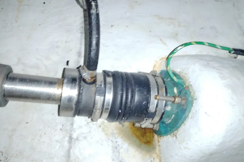 Slide: The Image of Close-up of a 2000 Bayliner 3988 Command Bridge Motoryacht's shaft seal and hose connection. - 61