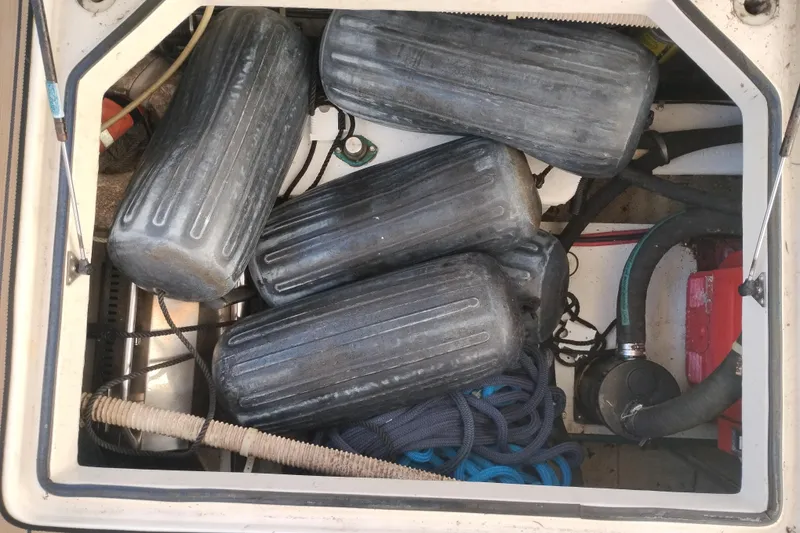 Slide: The Image of Storage compartment of 2000 Bayliner 3988 Command Bridge Motoryacht with fenders and ropes. - 65