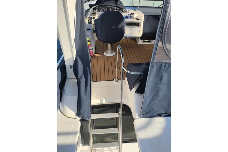 Slide: The Image of 2000 Bayliner 3988 Command Bridge Motoryacht interior with helm and seating area. - 7