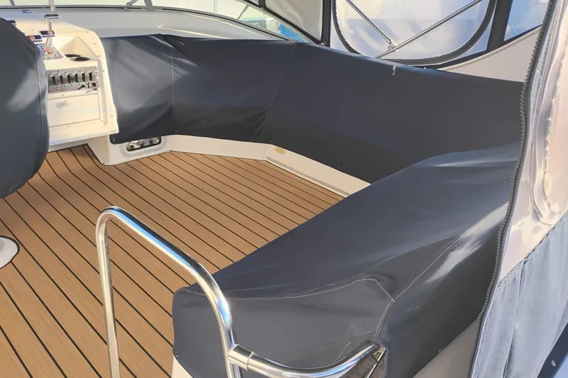 Slide: The Image of Interior of 2000 Bayliner 3988 Command Bridge Motoryacht with wood flooring and blue seating. - 9