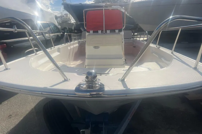 Slide: The Image of 2023 Boston Whaler 170 Montauk boat, docked with red seating and stainless steel railings. - 3