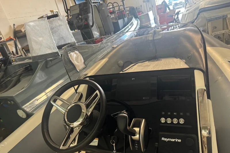 Slide: The Image of 2023 Williams Jet Tenders Dieseljet 445 interior with steering wheel and control panel. - 2