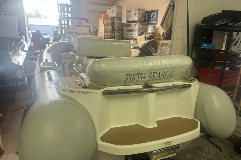 Slide: The Image of 2023 Williams Jet Tenders Dieseljet 445 in workshop, featuring "Fifth Season" on seat. - 3