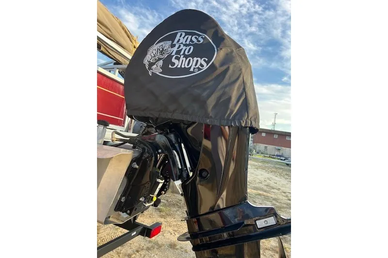 Slide: The Image of 2023 Sun Tracker Bass Buggy 18 DLX motor with Bass Pro Shops cover. - 2
