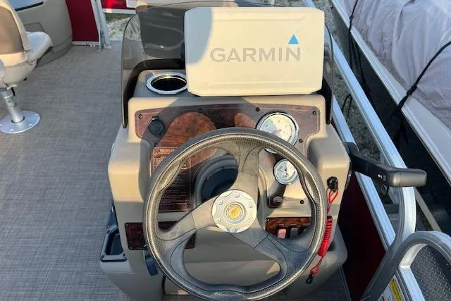 Slide: The Image of 2023 Sun Tracker Bass Buggy 18 DLX dashboard with Garmin navigation system. - 5