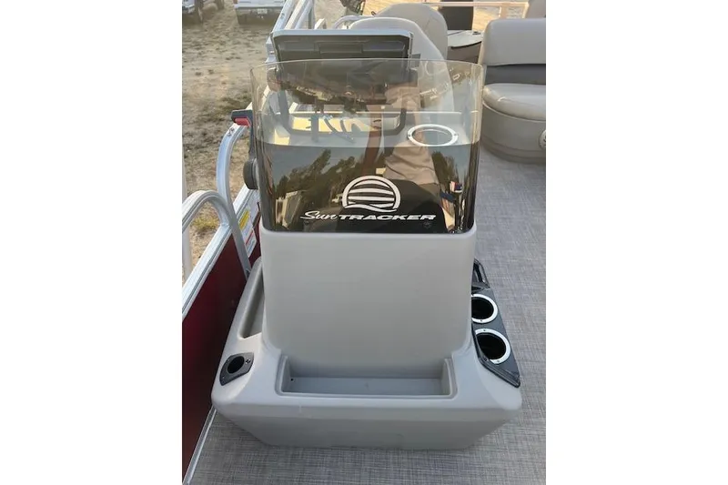 Slide: The Image of 2023 Sun Tracker Bass Buggy 18 DLX console with windshield and cup holders. - 8